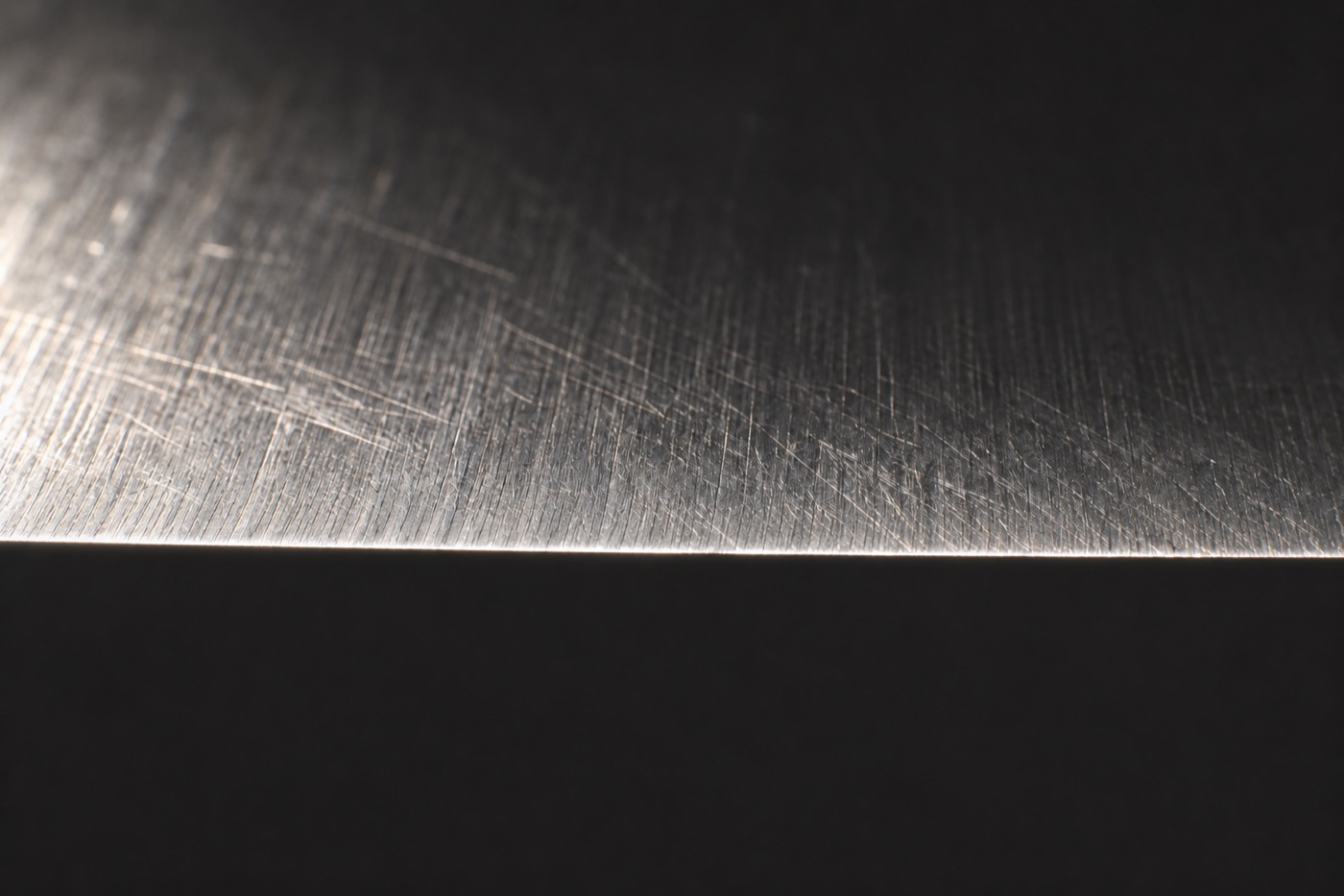 Close-up of the same knife edge after sharpening, with a clean, thin edge